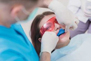 A dentist gives his patient fluoride treatments in TX