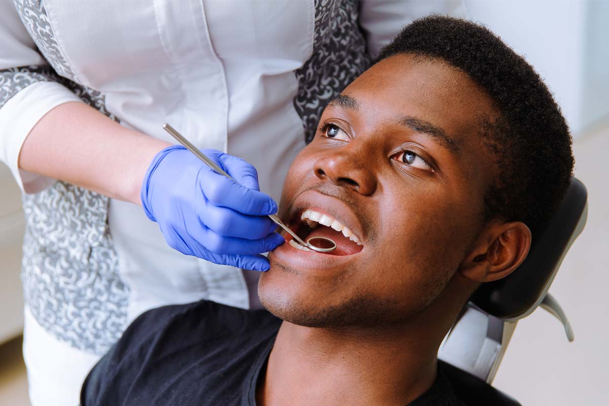 male patient receiving dental bonding services
