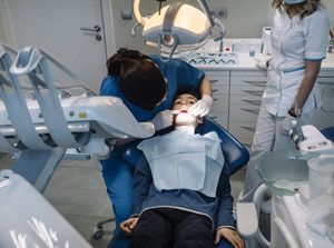 a man receives oral surgery