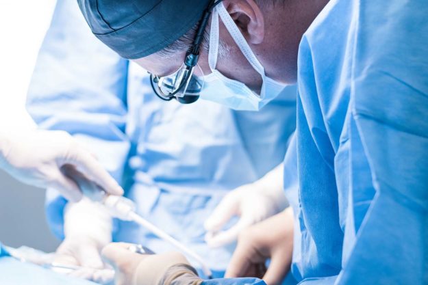 a doctor performing dental implant surgery