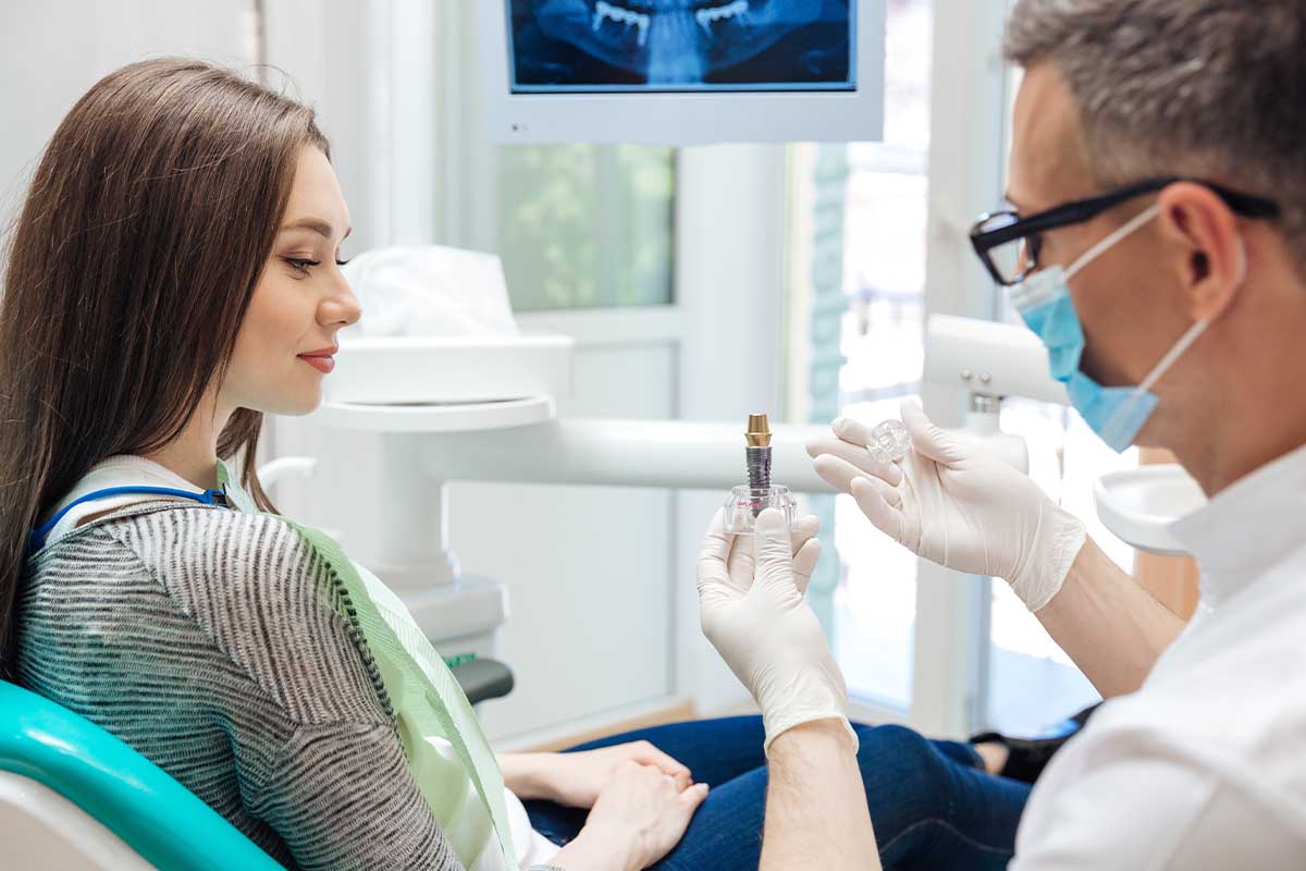 What is a Single Tooth Implant a woman learns about a single tooth implant