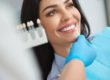a woman is happy with her dental veneers